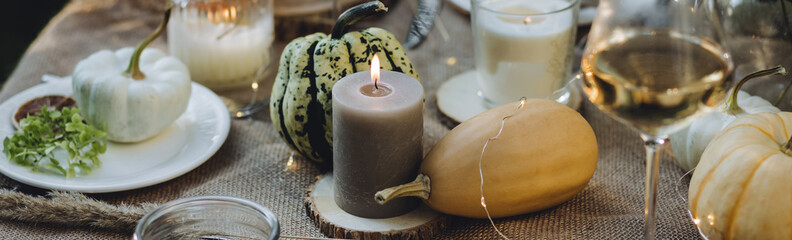 Banner. Cozy fall table decoration for Thanksgiving family dinner, romantic autumn wedding outdoors...