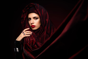 Elegant Tempting Portrait of a Woman in Red Fabric Highlighting Beauty and Glamour