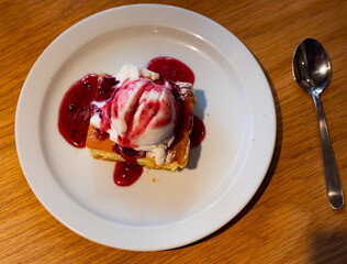 Blueberry cheesecake with ice cream - popular american dessert cheesecake