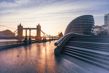 A beautiful morning at Queen's Walk showcases Tower Bridge towering over the River Thames. Soft...