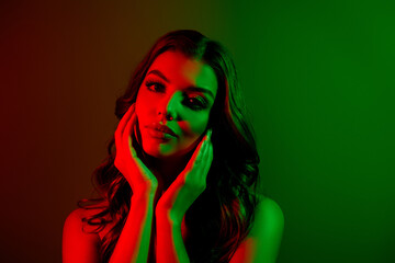 Photo of lovely lady model touching sensual flawless skin isolated multicolor red green neon light...
