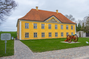 Located in Copenhagen, the Commander's House of Kastellet features a distinctive yellow facade and...