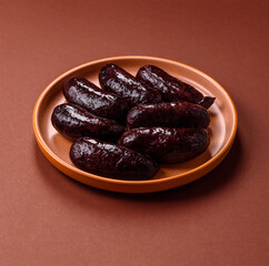 Blood sausage, pudding, meat food with lard and spices. Blood sausage