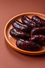 Blood sausage, pudding, meat food with lard and spices. Blood sausage