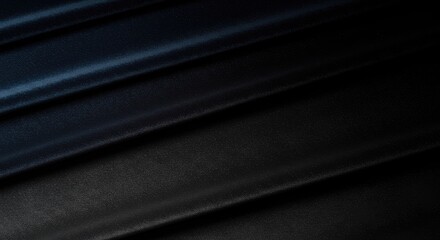 Close-up of dark fabric draped in diagonal folds