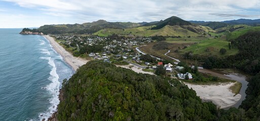 Aerial view of Whiritoa, Coromandel Peninsula, New Zealand, nestled between the ocean and rolling...
