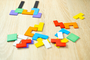 colorful wooden geometric pieces intellectual puzzle, intelligence quotient, quantitative indicator...
