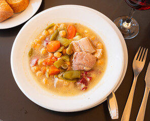 Popular dish of Spanish cuisine is Cocido de garbanzos, made from meat, vegetables and chickpeas