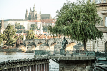 The statue of composer Bedrich Smetana stands by the Vltava River, offering a stunning view of...