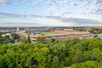 Great Strahov Stadium in Prague showcases its massive structure surrounded by lush greenery. This...