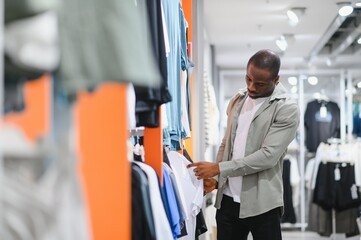 African american man shopping for stylish clothes