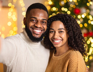 Happy couple captures joyful moment in front of a beautifully decorated Christmas tree with glowing lights and warm atmosphere