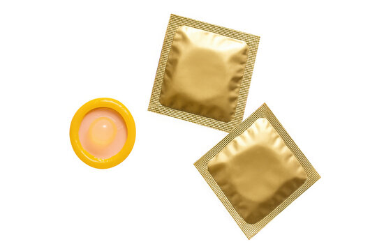 One condom and two gold foil packages isolated on white isolated on transparent background