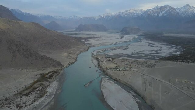 Aerial view of Indus River winding through mountains, Pakistan.