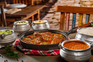 tipical brazilian recipe with farm chicken, gravy, rice and okra ( galinha caipira ).