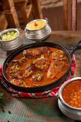 tipical brazilian recipe with farm chicken, gravy, rice and okra ( galinha caipira ).