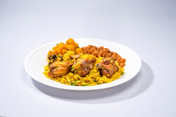 typical brazilian dish ( galinhada ) with curcuma seasoned, chicken and rice on rustic set.