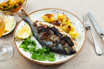 Grilled sea bream or dorado with boiled potatoes
