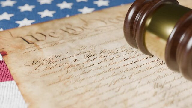 United States Constitution, Gavel and American Flag Resting on Table.