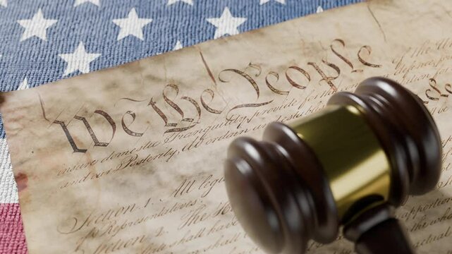 United States Constitution, Gavel and American Flag Resting on Table.