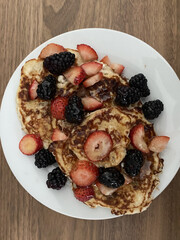 close-up image of delicious homemade pancakes with berries