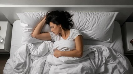 Restless woman struggling with insomnia in bed at night