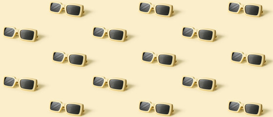 Many sunglasses on beige background