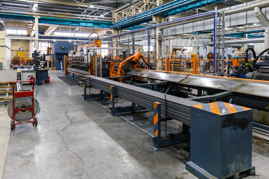 Metalworking factory production line. Production of metal profile cable canals