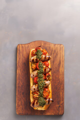 
National Dishes of Argentina - Grilled Sausage Sandwich. Spicy sausage topped with juicy tomatoes, crispy onions and a dollop of Argentine chimichurri, all wrapped up in a crispy baguette bun.