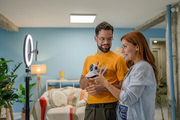 couple video bloggers record video about home cctv security camera