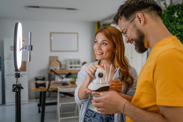 couple video bloggers record video about home cctv security camera