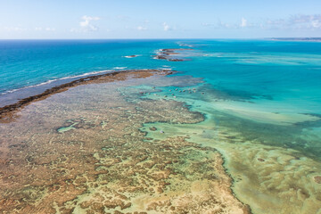 Boats on the shallow waters of Antunes natural pools in Maragogi. Alagoas, Brazil.