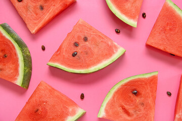 Composition with pieces of ripe watermelon on pink background