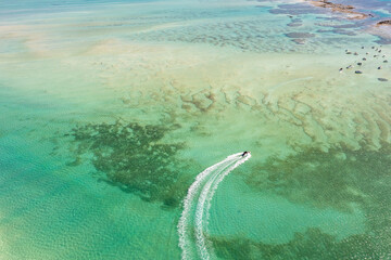 Boat approaching Antunes natural pools in Maragogi. Alagoas, Brazil.