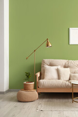 Interior of modern living room with cozy sofa and standard lamp