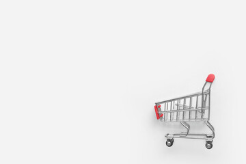Red shopping cart on white background.