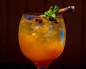 A beautifully crafted cocktail with cinnamon and mint, perfect for a special occasion.