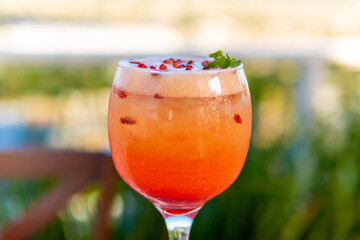 A refreshing cocktail with berries and mint, perfect for a summer celebration.