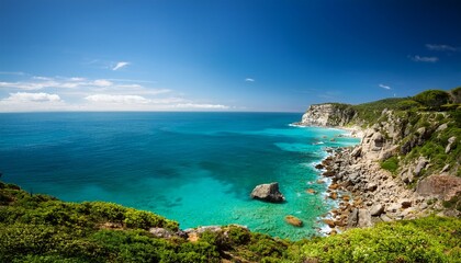 this scene features stunning coastal cliffs bordered by clear turquoise waters rocky shores are interspersed with lush green vegetation creating a tranquil atmosphere under a bright blue sky