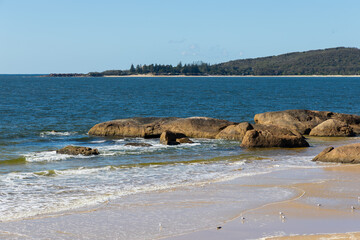 Rocky coastline view during the sunny day.