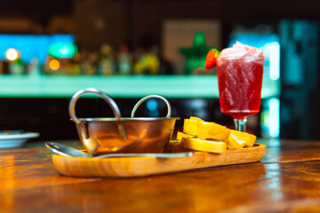 A beautifully presented cocktail and bread, perfect for a stylish evening.