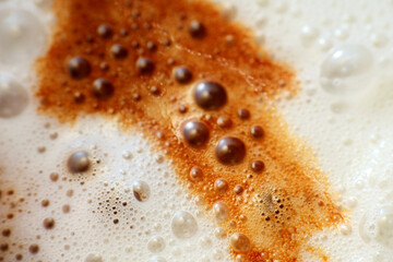 Close up shot of coffee on milk