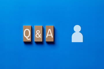 There is wood block with the word Q&A. It is as an eye-catching image.