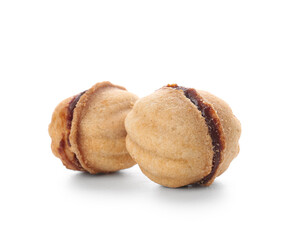 Sweet walnut shaped cookies with boiled condensed milk on white background