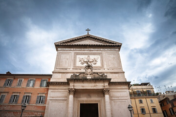 San Salvatore in Lauro church facade in Rome, travertine walls with columns, pediment inscription 'Mariae Lauretanae Piceni Patronae', meaning Mary of Lorraine, Patroness of Picenum in latin.