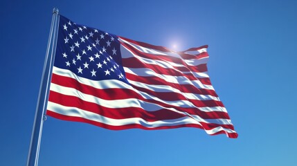 Obraz premium A low angle view of the american flag waving against a clear blue sky on a sunny day outdoors