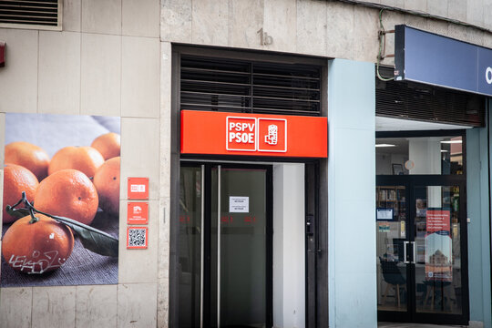 VALENCIA, SPAIN - APRIL 15, 2025: The bright red signage of Spain Socialist parties PSPV and PSOE (partido socialista obrero espanol) above the entrance to their local headquarters in Valencia.