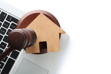 House figure with auction gavel and laptop on white background