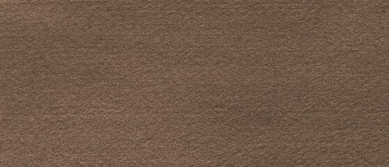 Fototapeta premium Brown fabric background texture. Brown felt abstract background with copy space for design. 