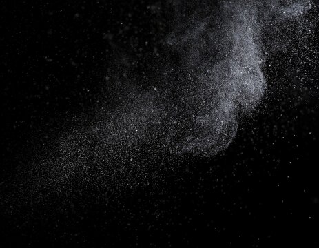 abstract real dust floating over black background
